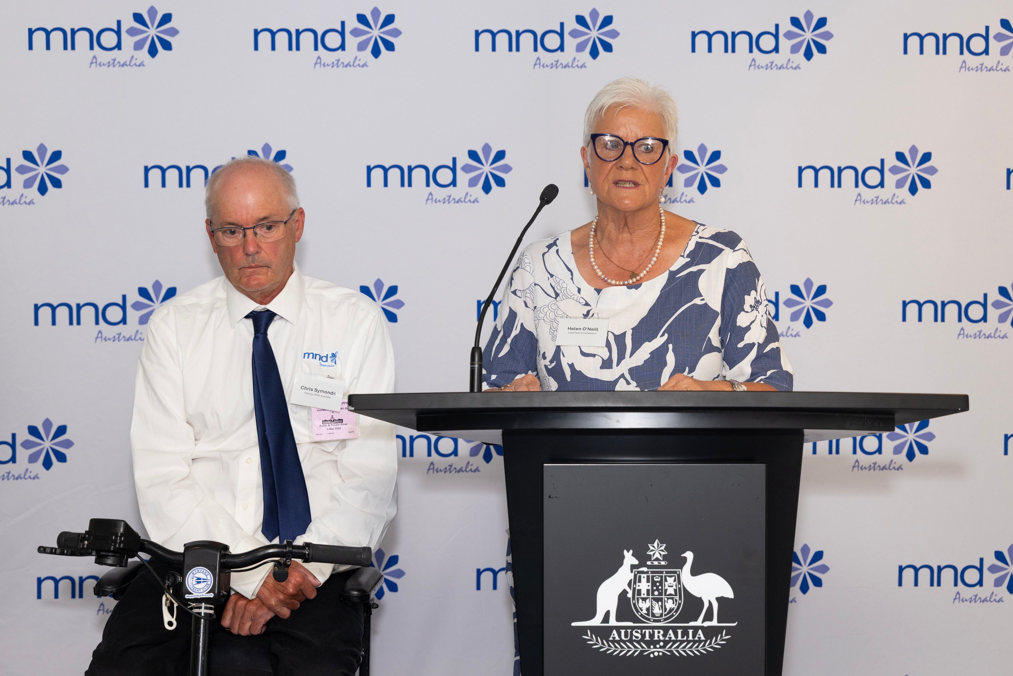 Helen O'Neill delivering speech at podium at Australian Parliament House.
